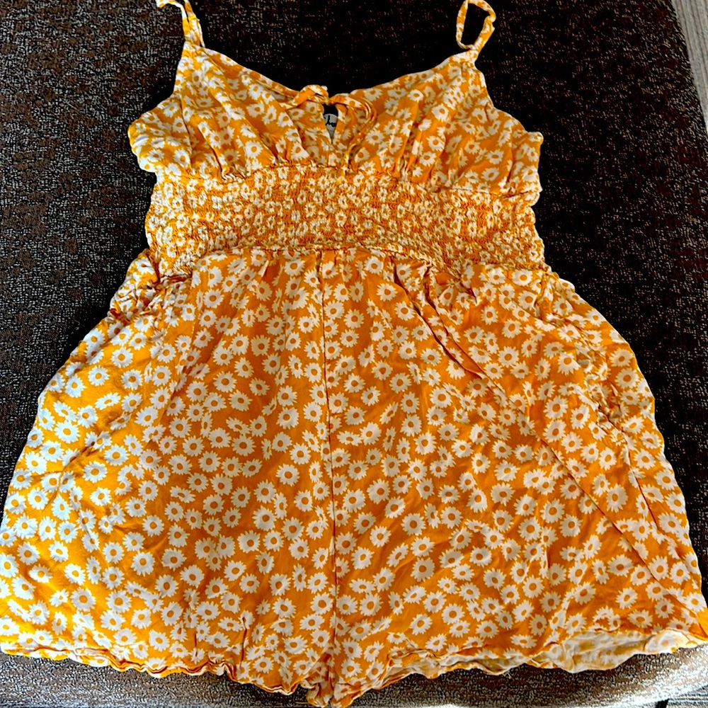 Sunflower yellow romper adjustable straps worn twice. Short.